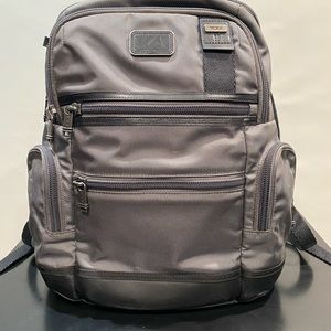 Tumi grey and black luxury backpack.